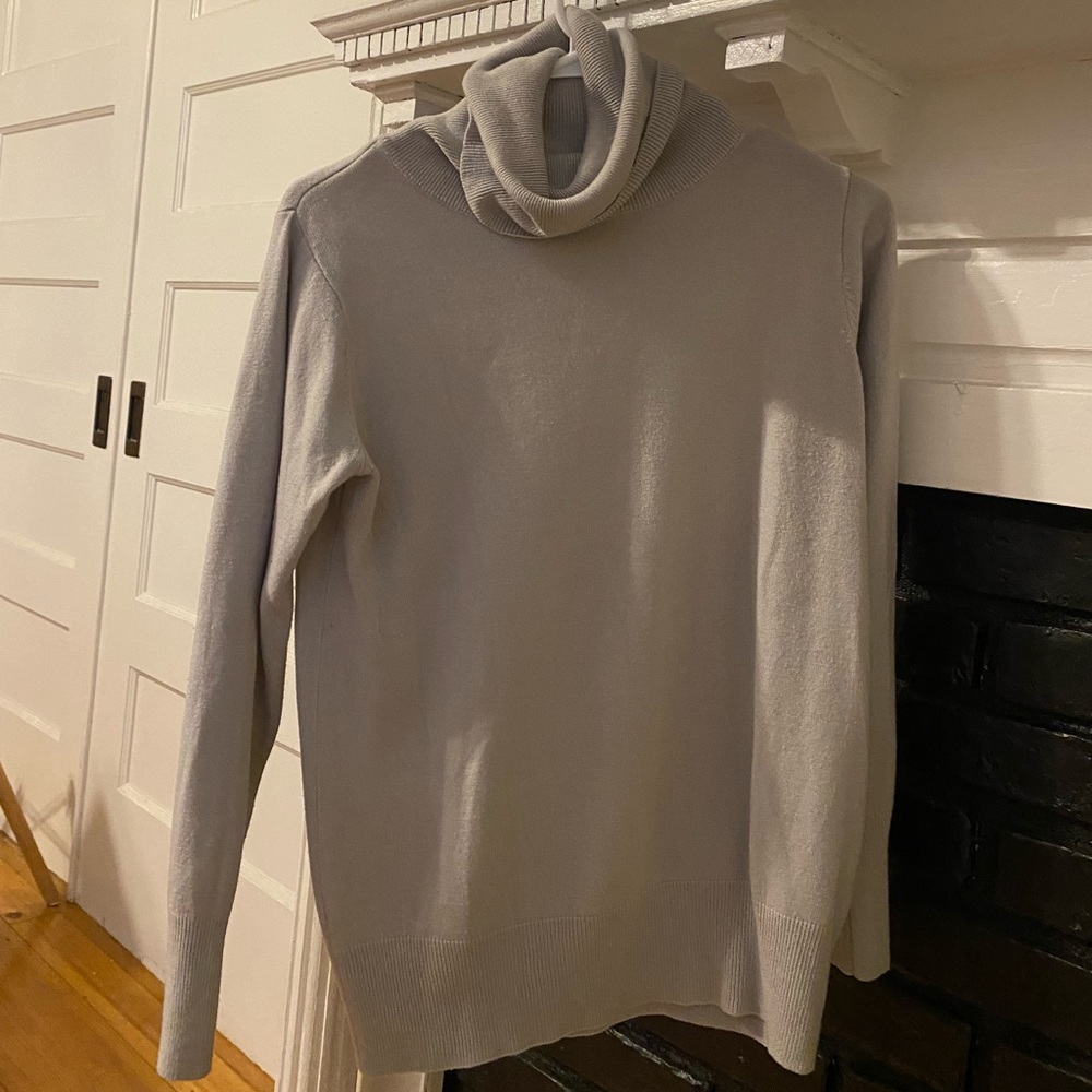 Purple turtle neck, size small. But in Japan.